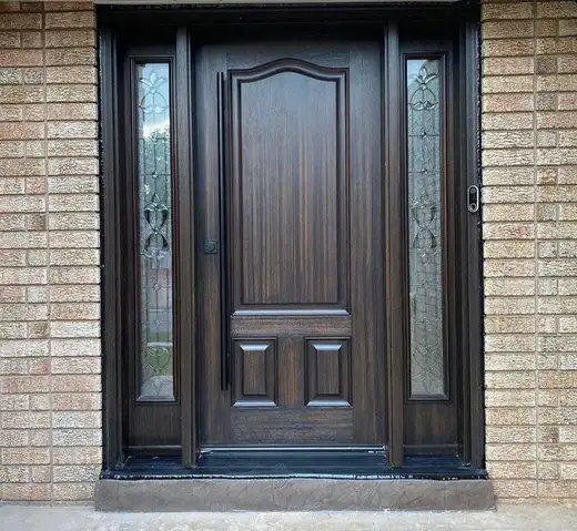 Mahogany-finish arched-panel entry door with decorative glass sidelites