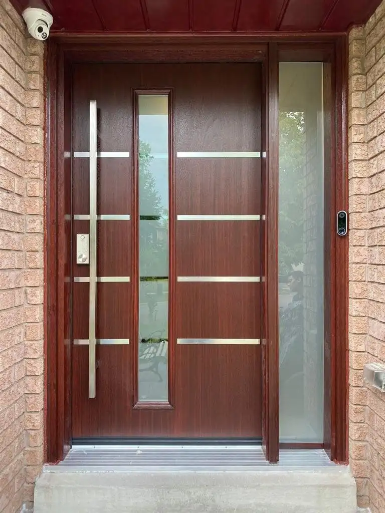 Mahogany-finish entry door with stainless bars, a narrow glass insert and a full-height sidelite, in red brick